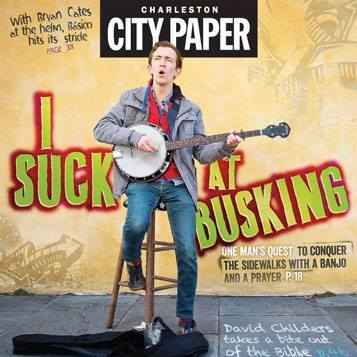 Cover of Charleston City Paper with the headline "I suck at busking." A man appears on a sidewalk singing and playing a banjo.