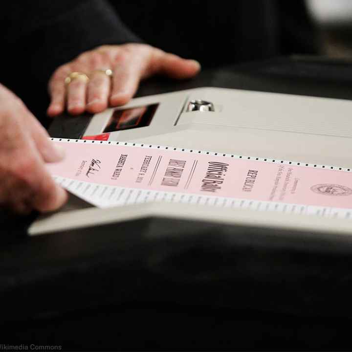 A ballot is entered into a machine at a polling site